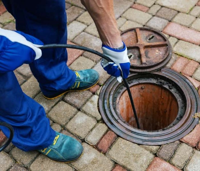 Sewer,Cleaning,Service,-,Worker,Clean,A,Clogged,Drainage,With